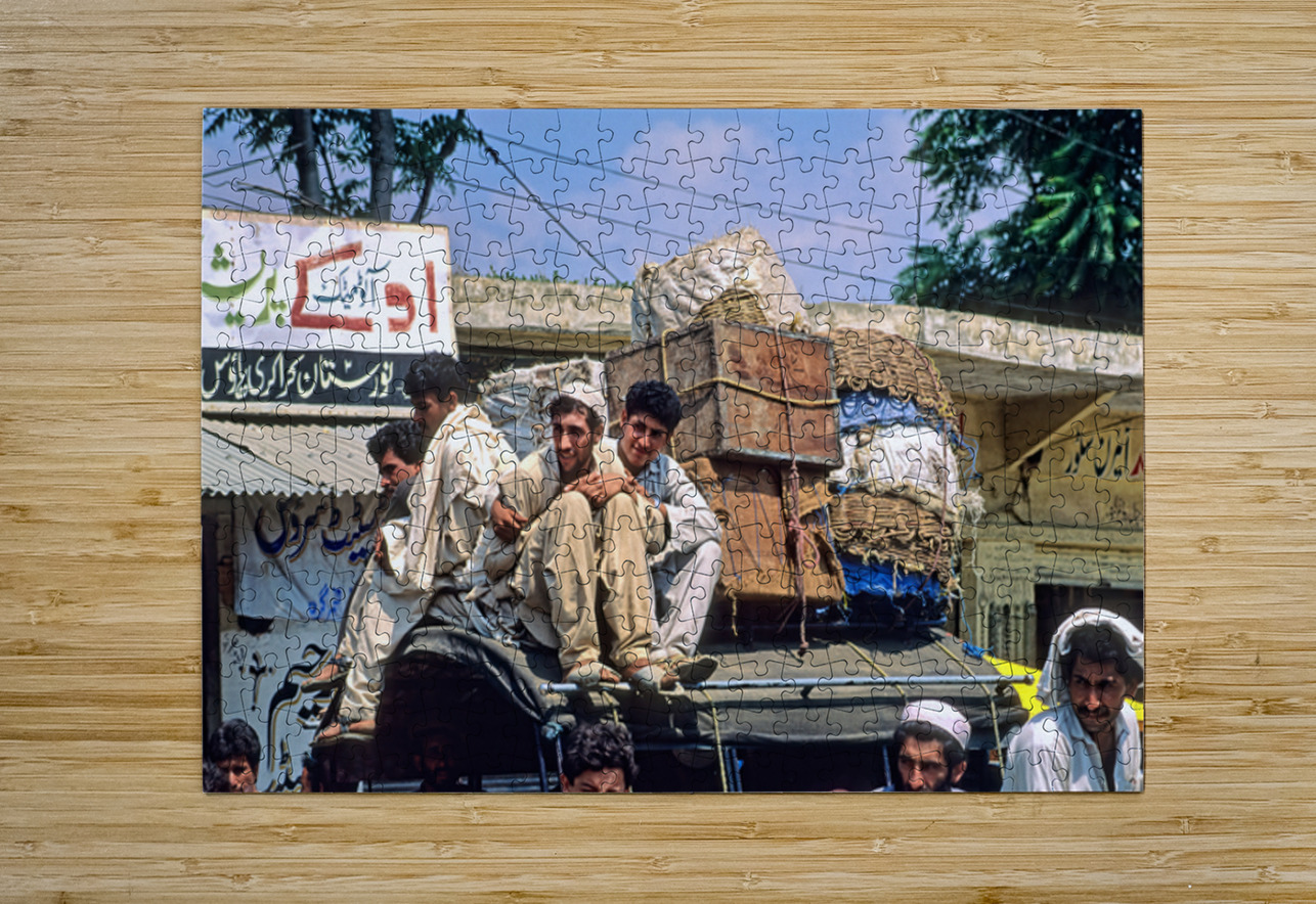 Men travel on top of a vehicle in Peshawar Pakistan Marco Brivio Puzzle printing