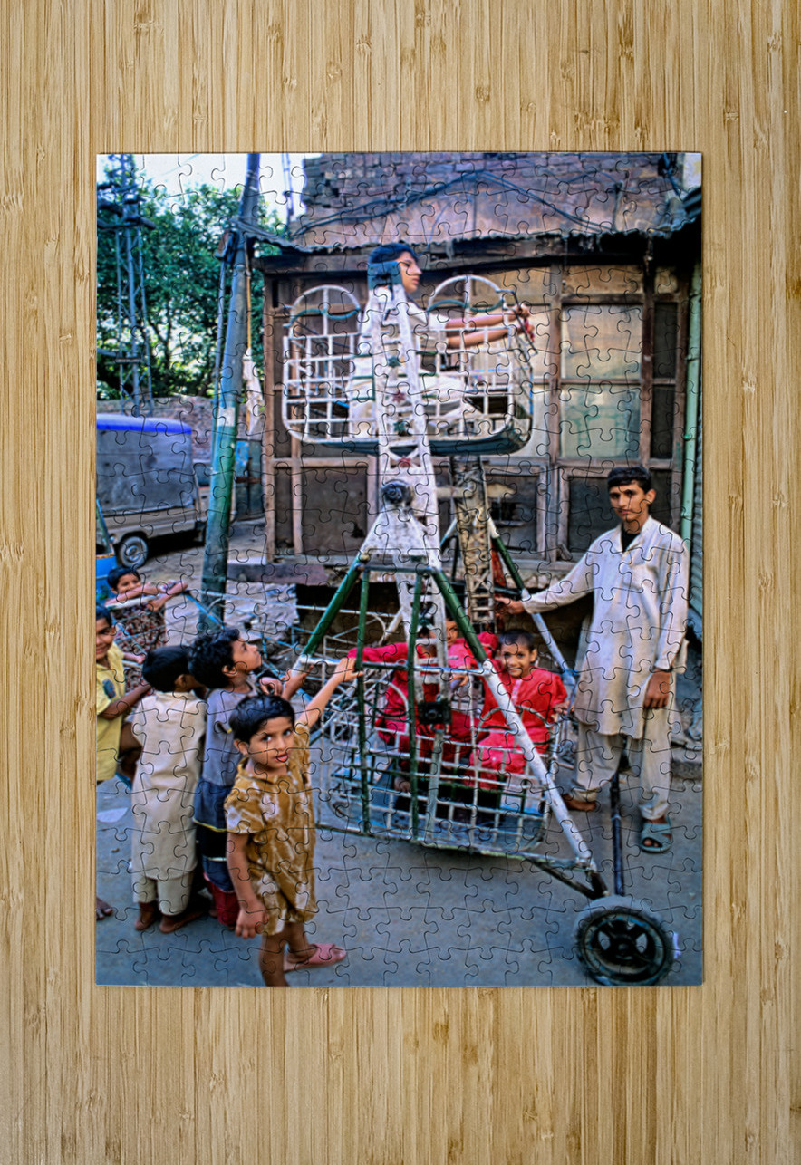 Children enjoy playtime on a swing in Lahore Marco Brivio Puzzle printing