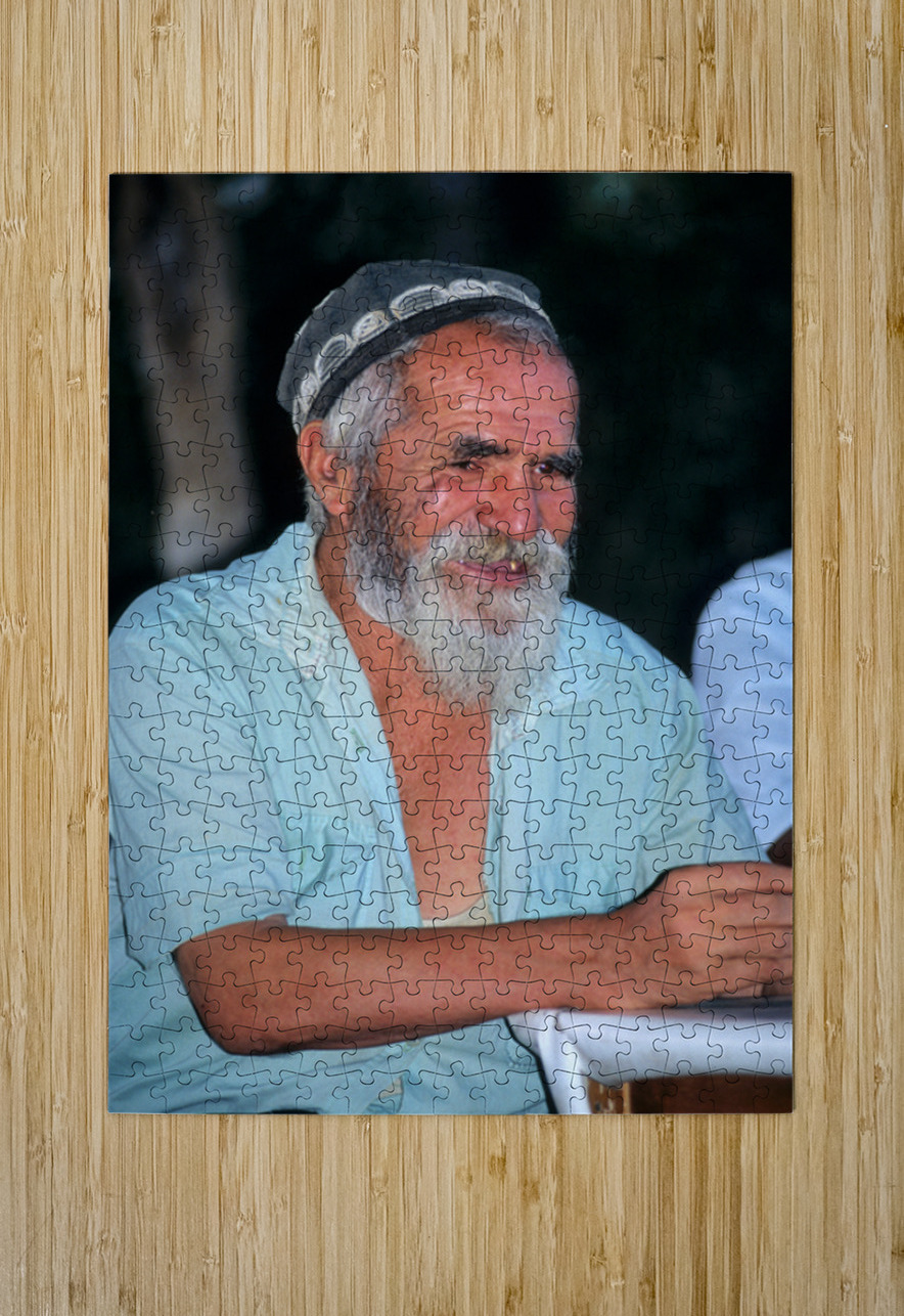 Elderly man smiles while sitting outdoors in Bukhara Uzbekistan Marco Brivio Puzzle printing