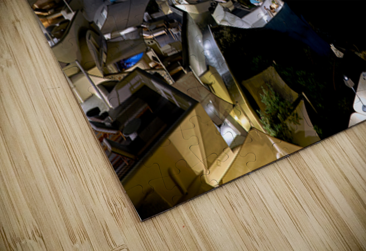 Illuminated cliffside town at night couple enjoying dinner. Marco Brivio Puzzle