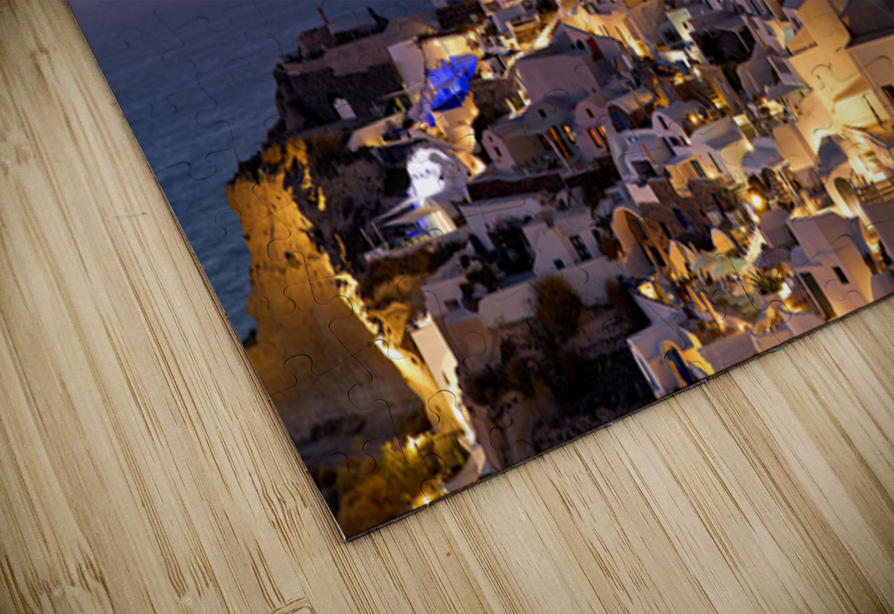 Santorinis Oia village glows at twilight by the sea. Marco Brivio Puzzle
