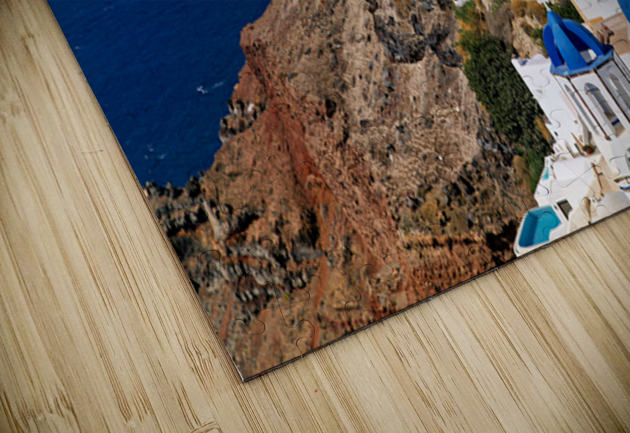 Santorinis iconic white buildings and blue domes overlooking th Marco Brivio Puzzle