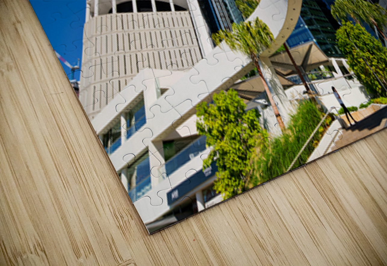 Woman walks on stairs in modern urban area with tall buildings Marco Brivio Puzzle