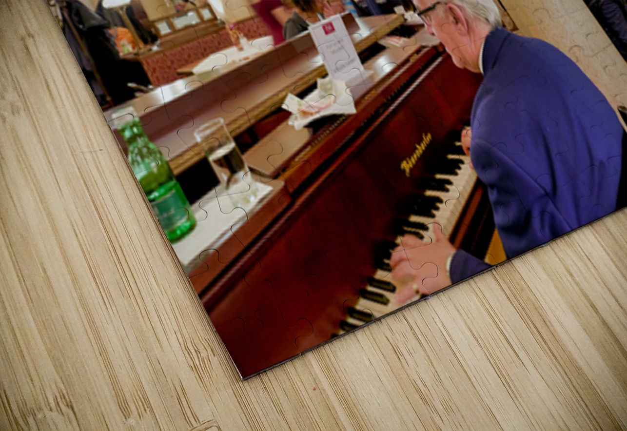 Man playing piano in an ornate bustling cafe. Marco Brivio Puzzle