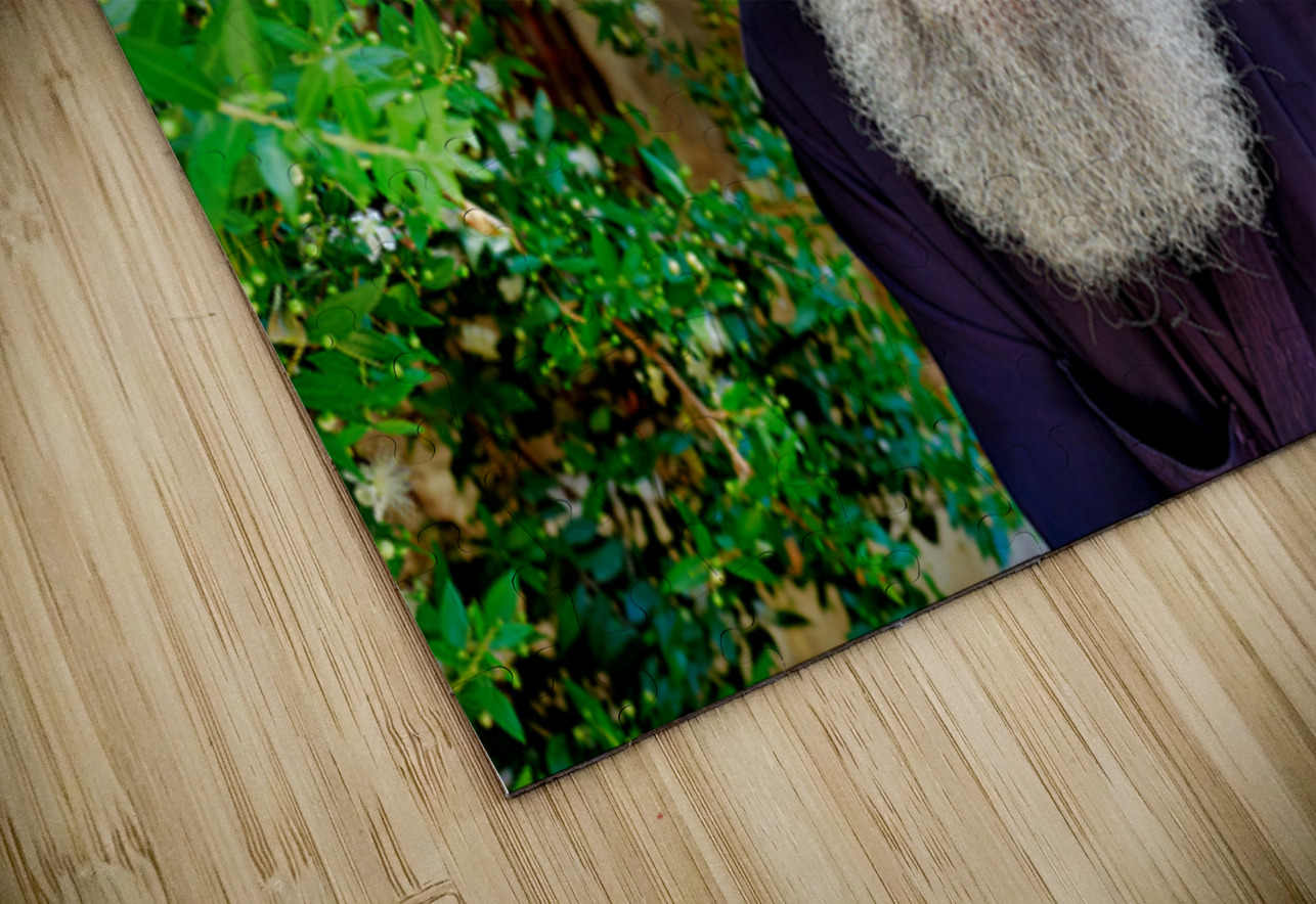 Elderly man with a beard poses near a historical building in a g Marco Brivio Puzzle