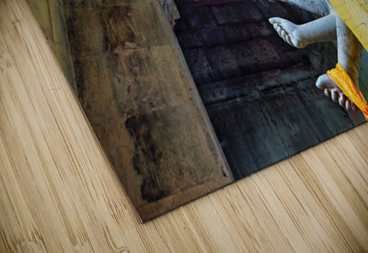 Ancient multi armed statue yellow fabric inside stone temple. Marco Brivio Puzzle