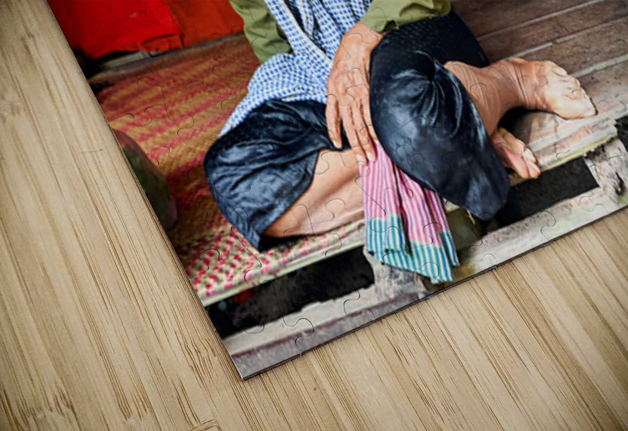 Elderly person sitting on floor in rustic dwelling. Marco Brivio Puzzle