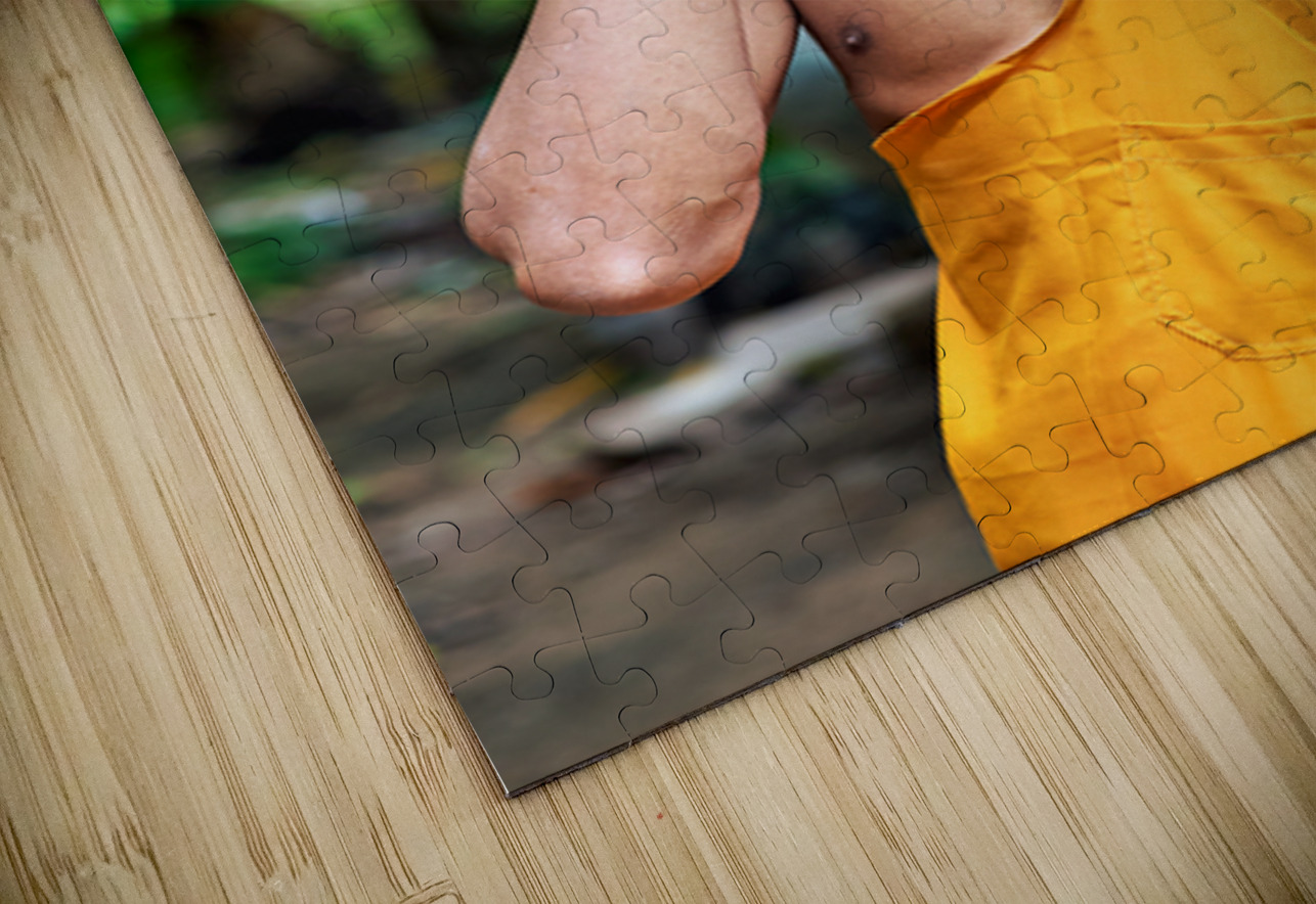 Smiling monk talks on phone with towel on head. Marco Brivio Puzzle