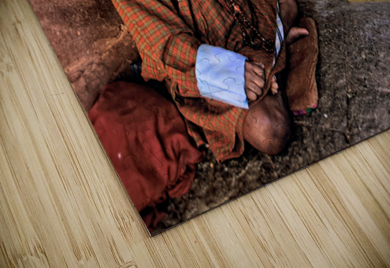 Bhutanese man with prayer beads and spinning prayer wheel. Marco Brivio Puzzle