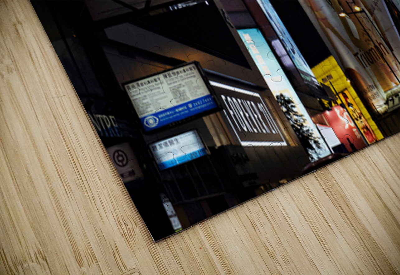 Neon signs light up a busy street in Hong Kong at night Marco Brivio Puzzle