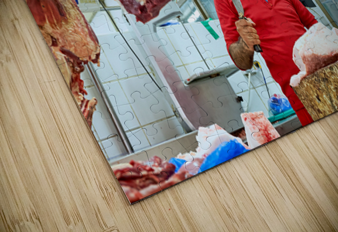 Butcher works with meat in a shop in Dubai UAE Marco Brivio Puzzle