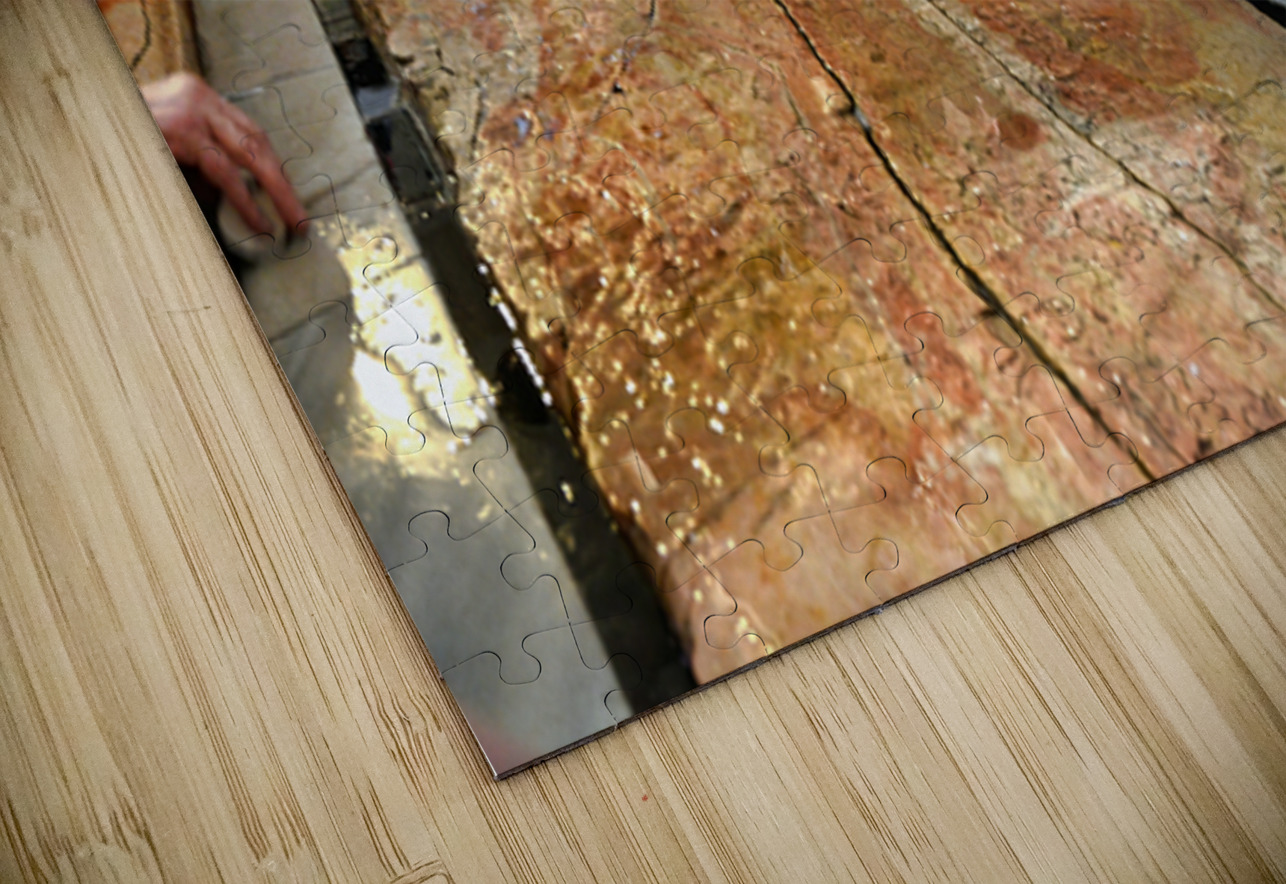 Visitors touch the stone of unction in the Holy Sepulchre Marco Brivio Puzzle