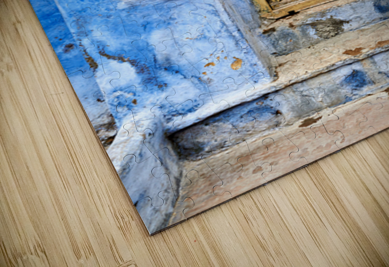 Goat standing on a wall by a wooden door in Bundi Rajasthan Marco Brivio Puzzle