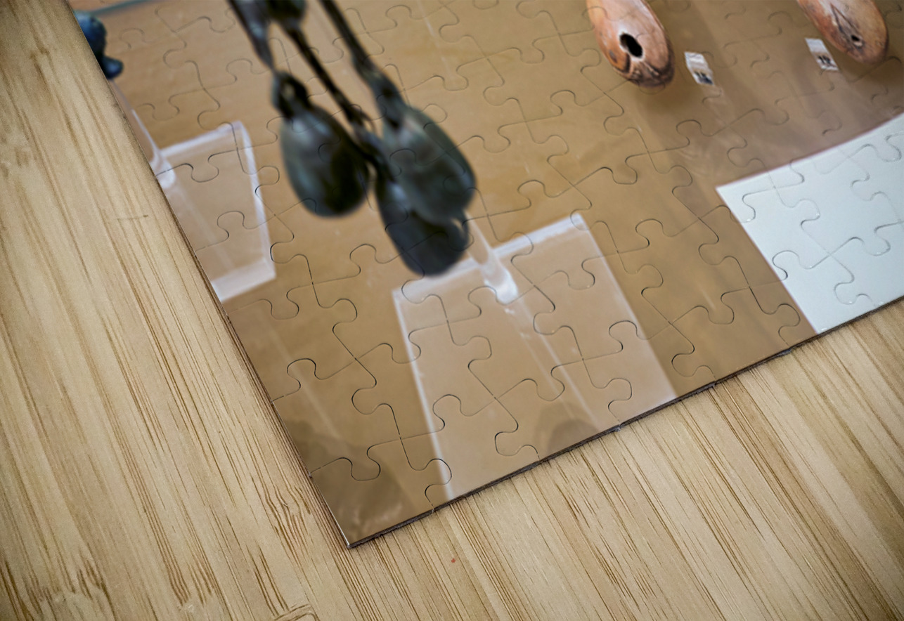 Displays of ancient artifacts are shown in glass cases Marco Brivio Puzzle