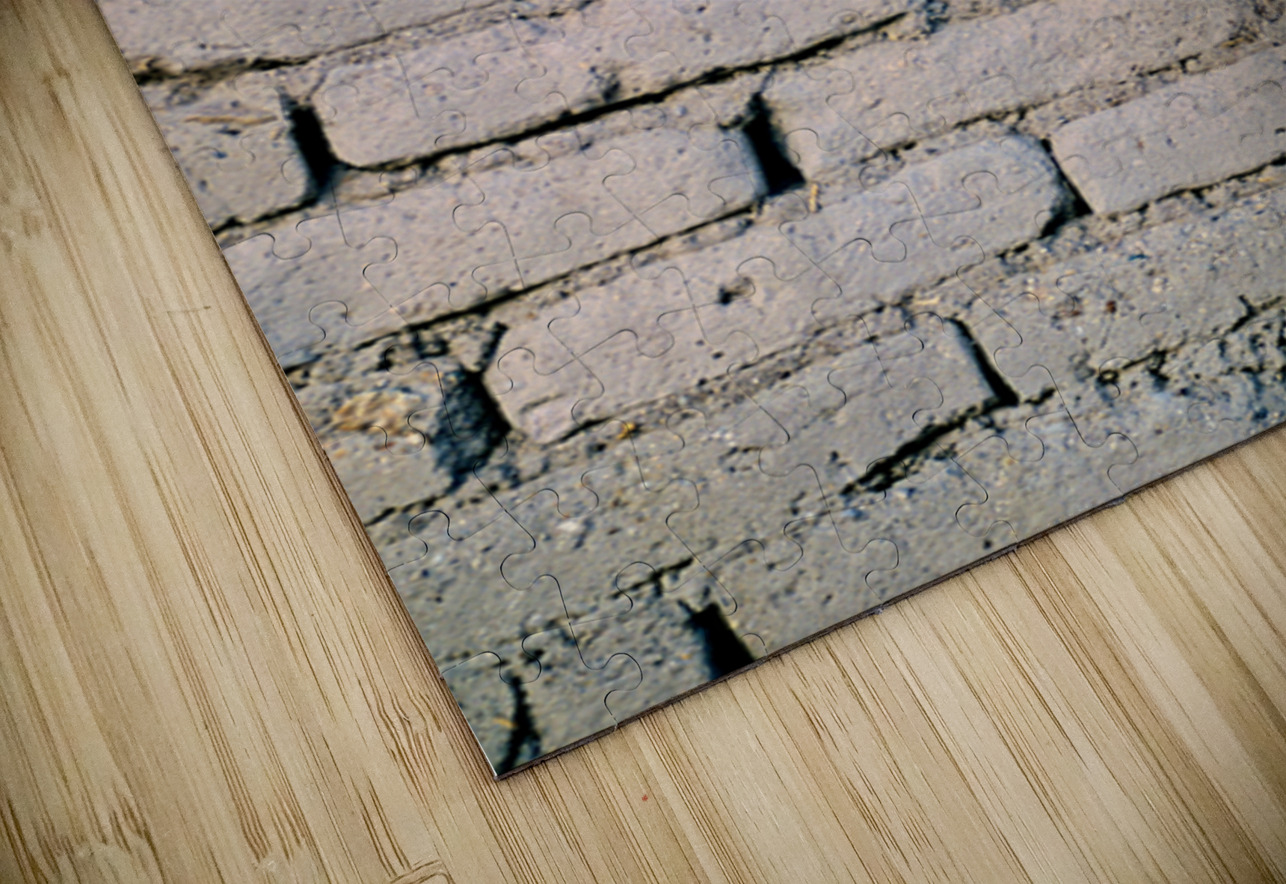 Young girl smiles over stone wall at sunset. Marco Brivio Puzzle