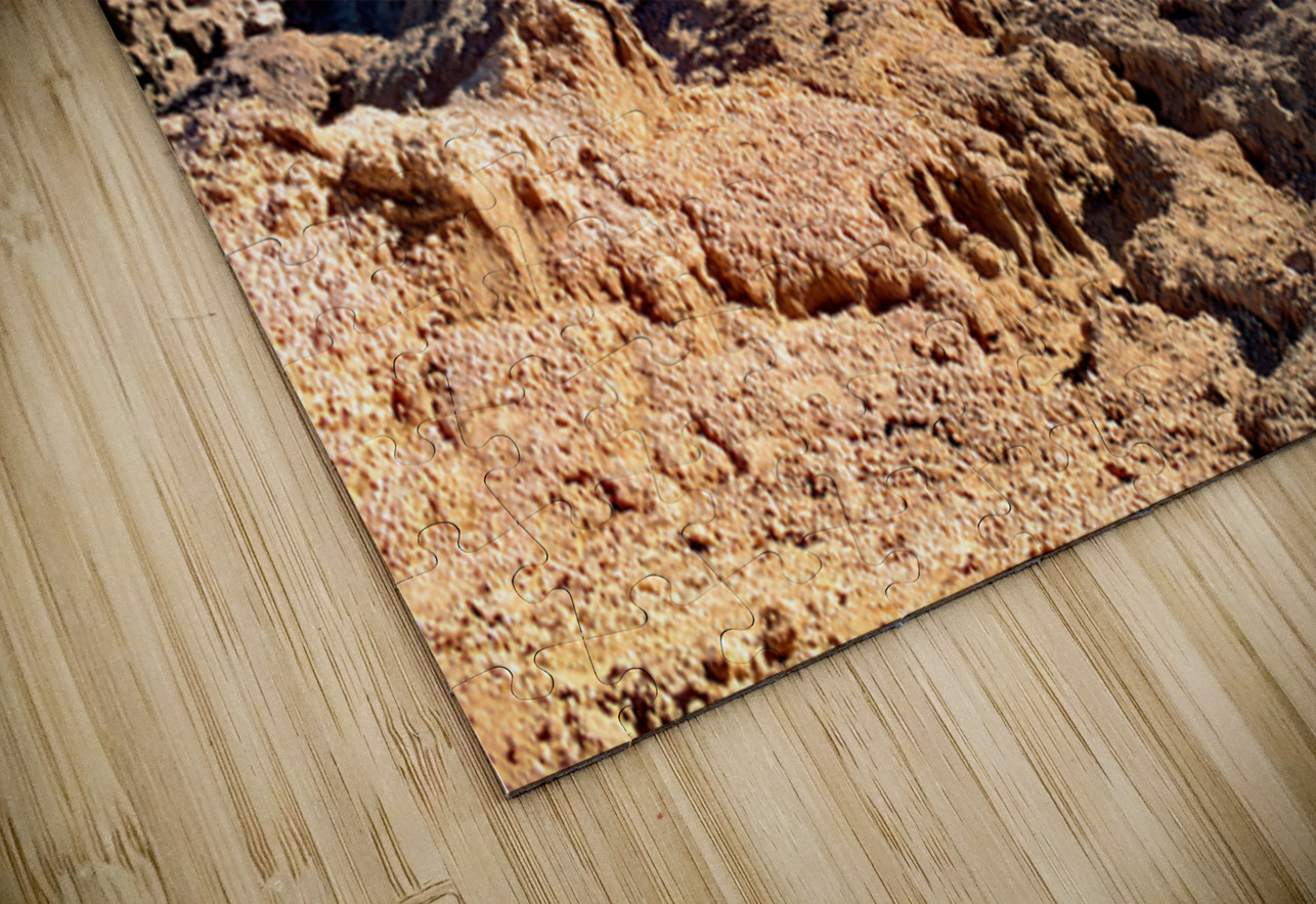 Hikers traverse a vast arid rocky desert landscape. Marco Brivio Puzzle