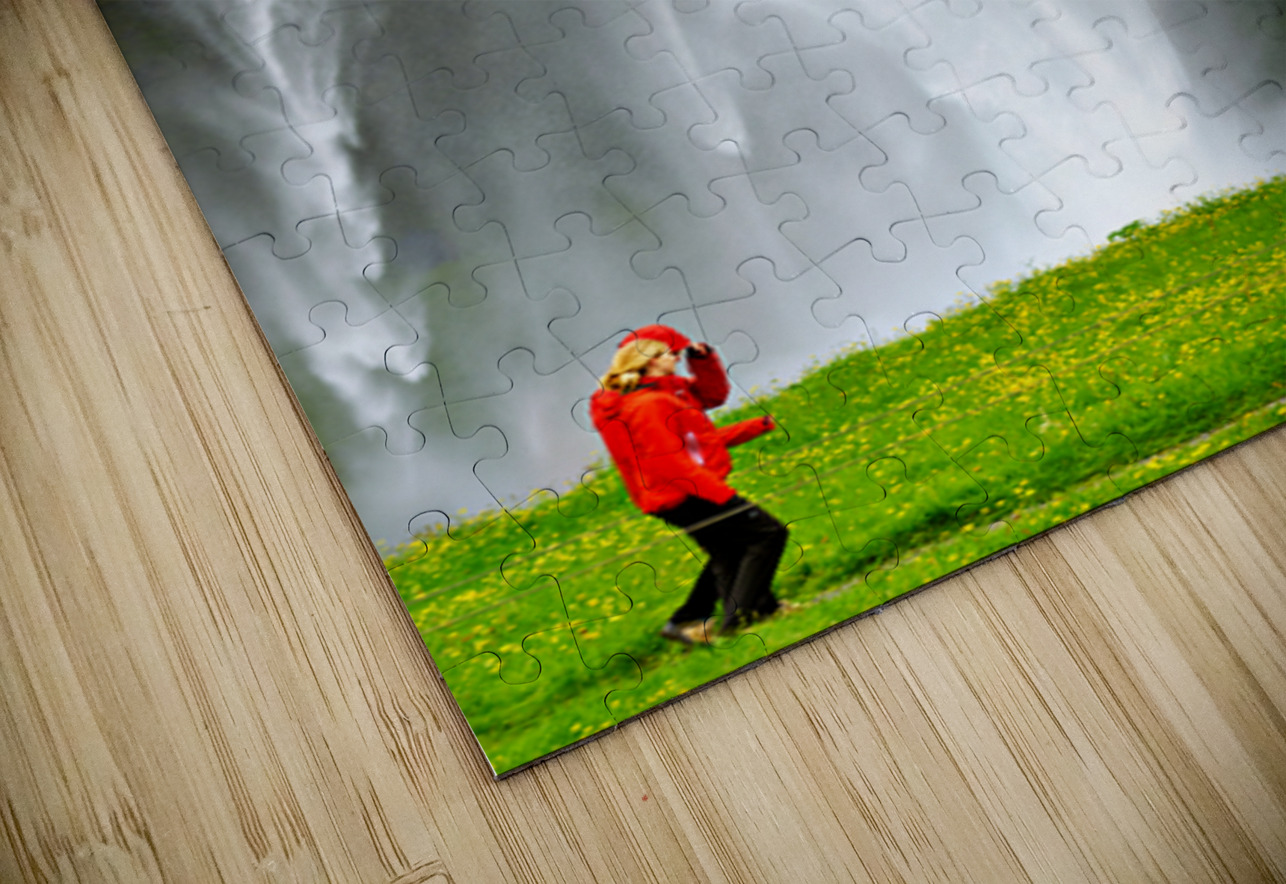 Woman walks near Seljalandsfoss waterfall in Iceland Marco Brivio Puzzle