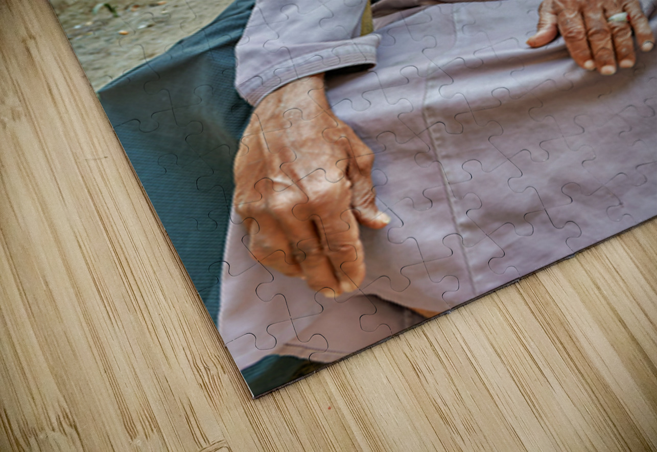 Old man sitting in a historical site in Muscat Oman Marco Brivio Puzzle