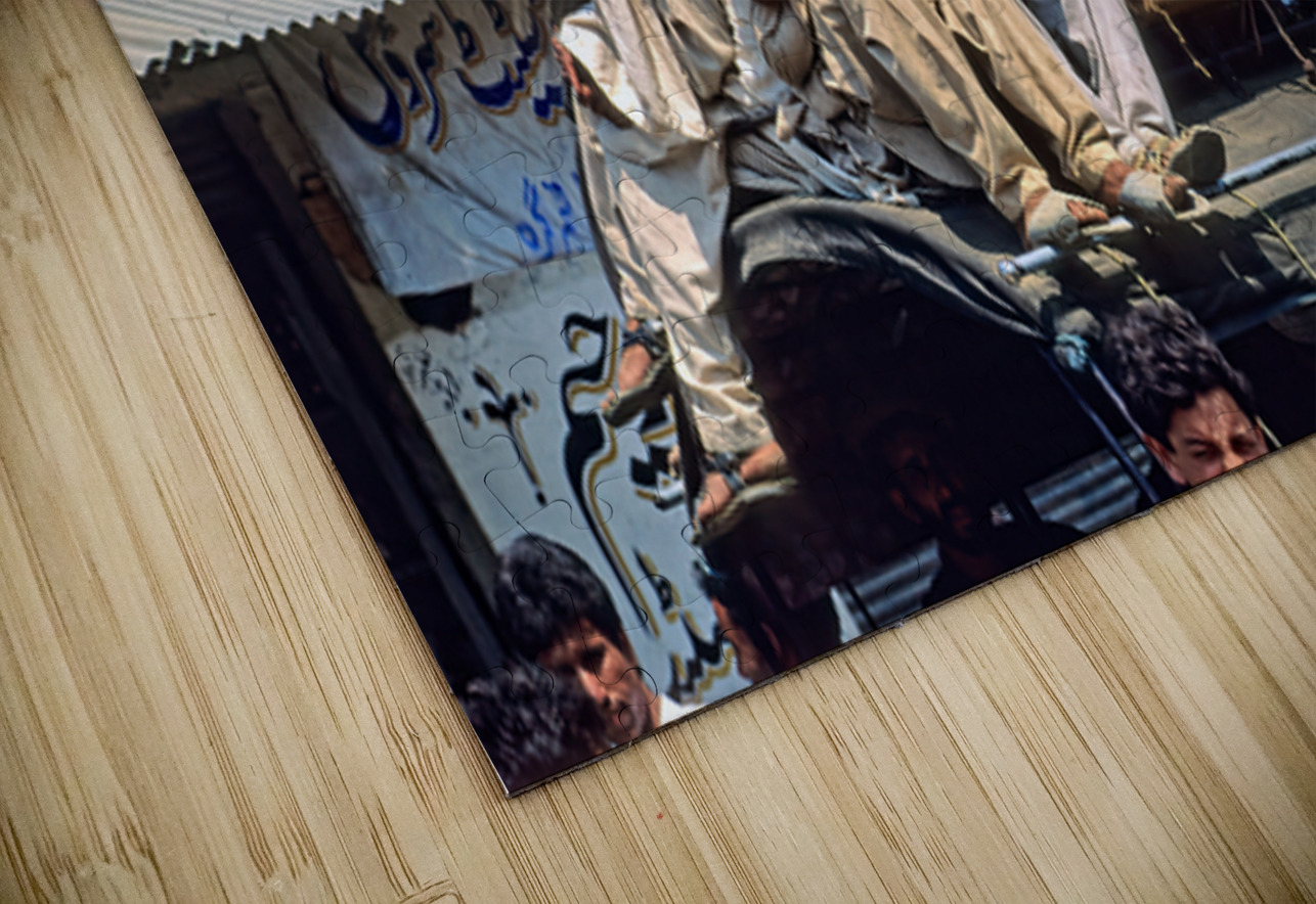 Men travel on top of a vehicle in Peshawar Pakistan Marco Brivio Puzzle