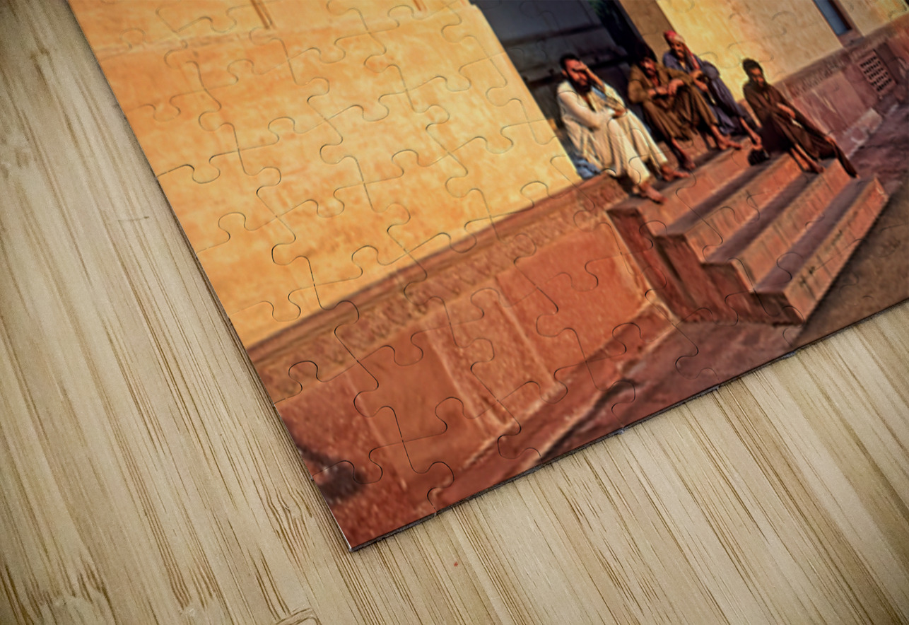 Visitors rest by Badshahi Mosque during sunset in Lahore Marco Brivio Puzzle