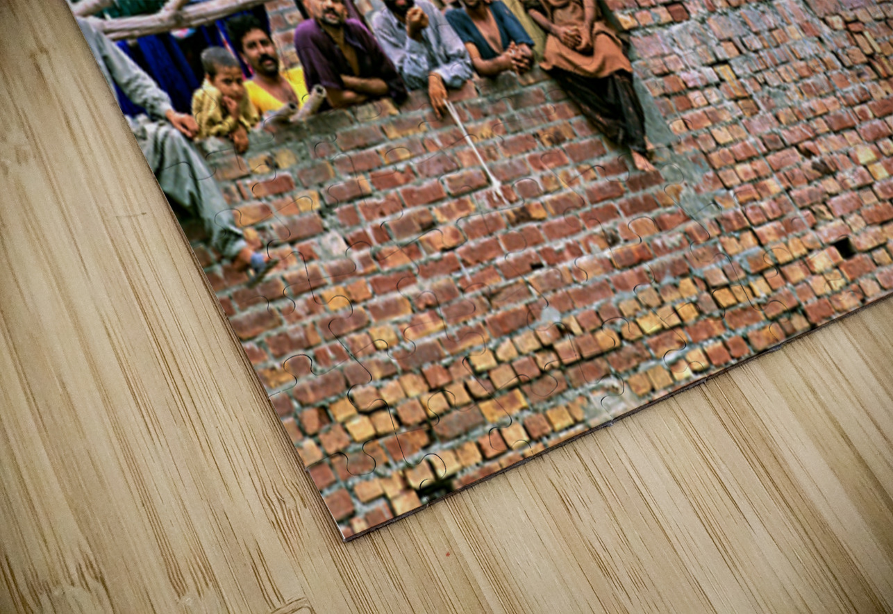 Workers rest during break time at a construction site in Lahore Marco Brivio Puzzle