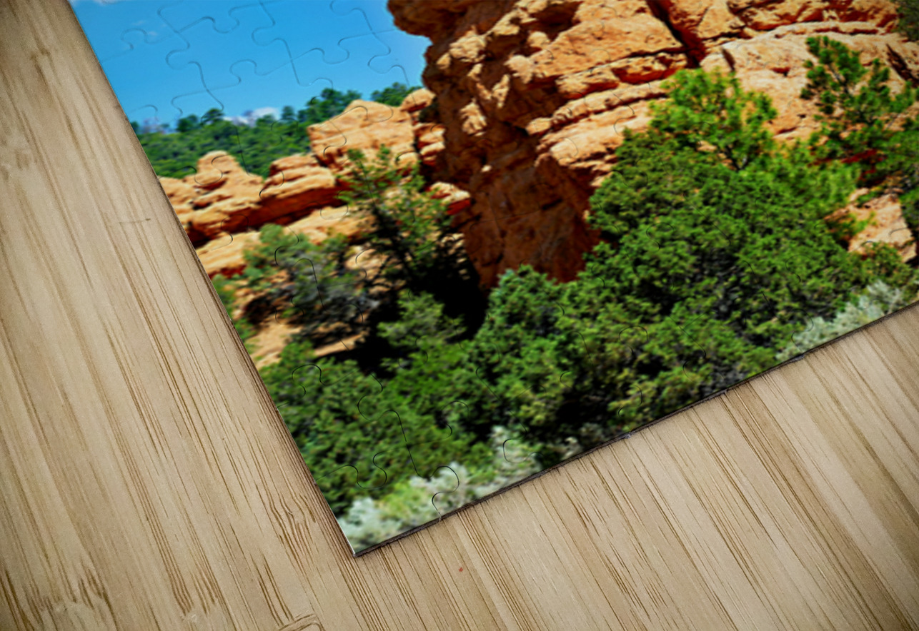 Rock formation towers over trees in Dixie National Forest Marco Brivio Puzzle