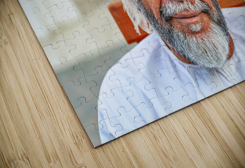 Man sitting on a bench in Muscat Oman during the day Marco Brivio puzzle