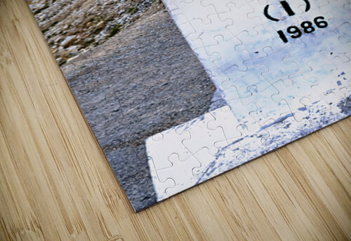 Distance marker showing 7 kilometers to Pakistan on road in 1986 Marco Brivio puzzle