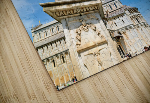 Visitors watch the Leaning Tower and the fountain of angels in Piazza dei Miracoli. Bright sky adds to the lively atmosphere in Pisa. Marco Brivio puzzle