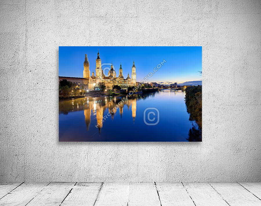 Zaragoza. Saragossa. Aragon. Spain. Cathedral Basilica of Our Lady of the Pillar and river Ebro at sunset Wall Preview
