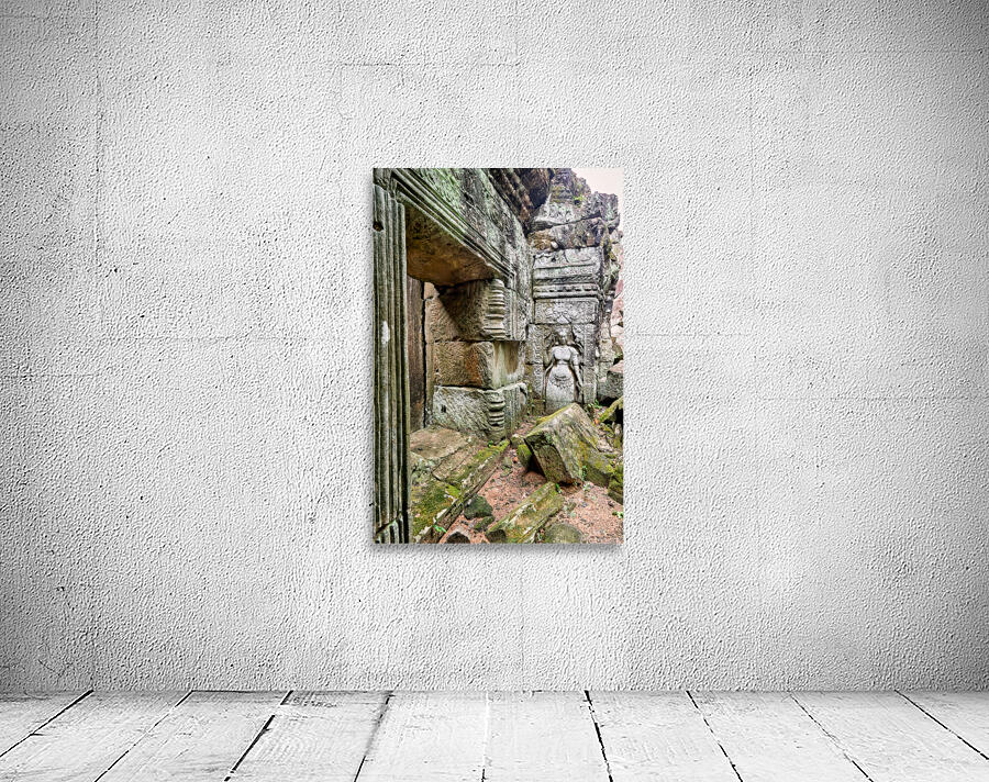 Ancient temple ruins with carved stone deity and moss. Wall Preview