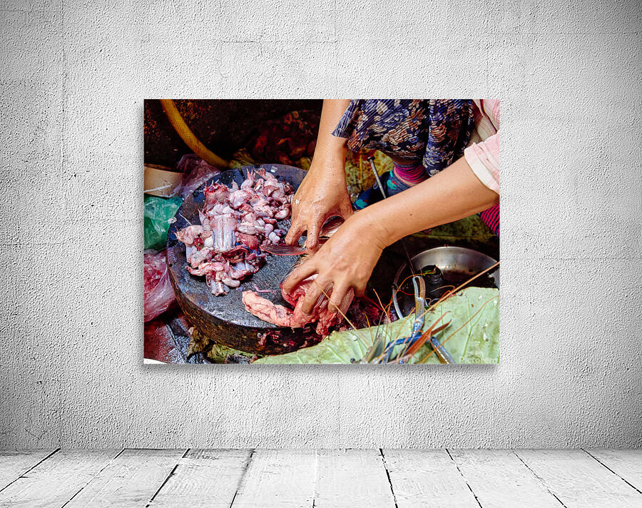 Hands preparing raw frog meat and seafood. Wall Preview