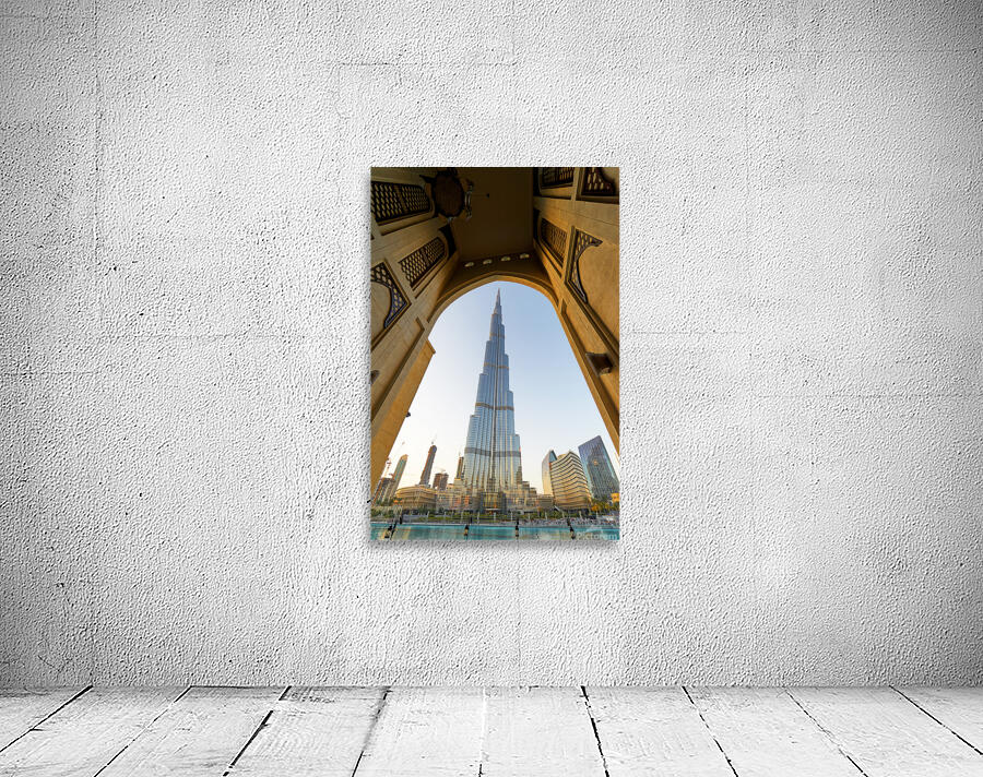 Burj Khalifa seen through ornate arch in Dubai cityscape Wall Preview
