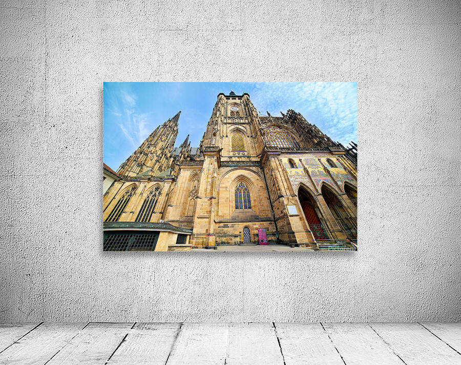 Ornate St. Vitus Cathedral facade against a blue sky. Wall Preview