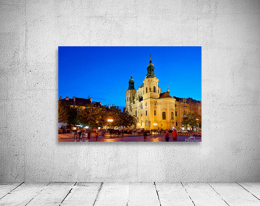 Illuminated church and lively square at night. Wall Preview