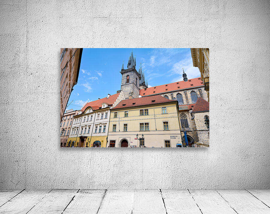 Pragues Týn Church and historic buildings under blue sky. Wall Preview