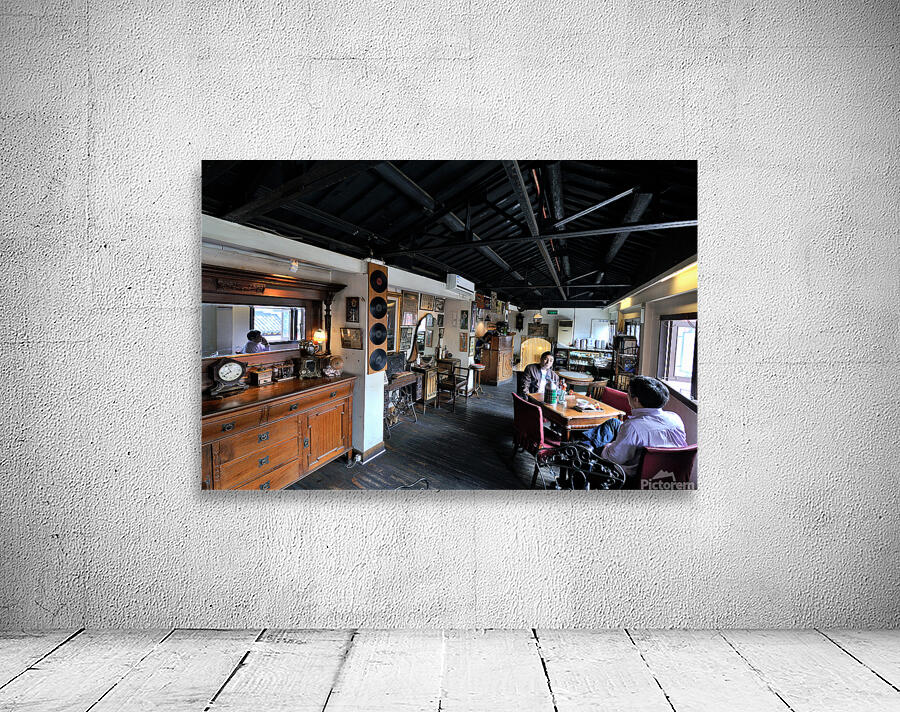 Customers enjoy drinks and food in a vintage cafe in Shanghai Wall Preview