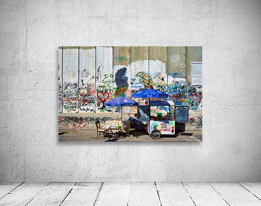 Separation wall in Bethlehem with a juice stand near graffiti Wall Preview