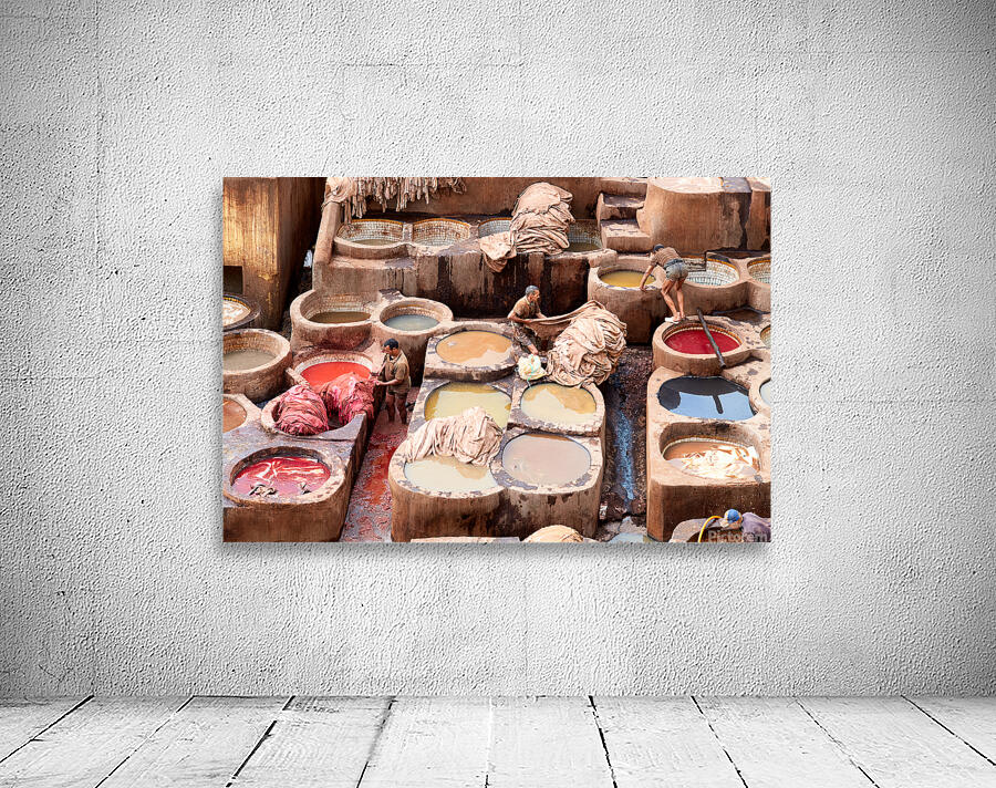 Workers dye leather at Chouara Tannery in Fez Morocco Wall Preview