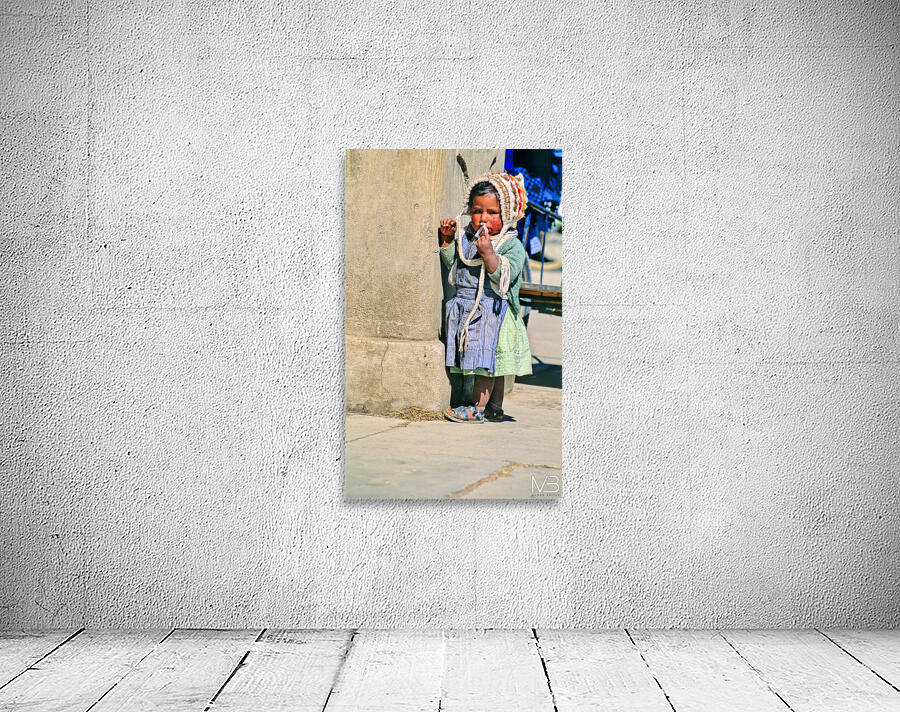 Young child in traditional attire appears to be smoking. Wall Preview