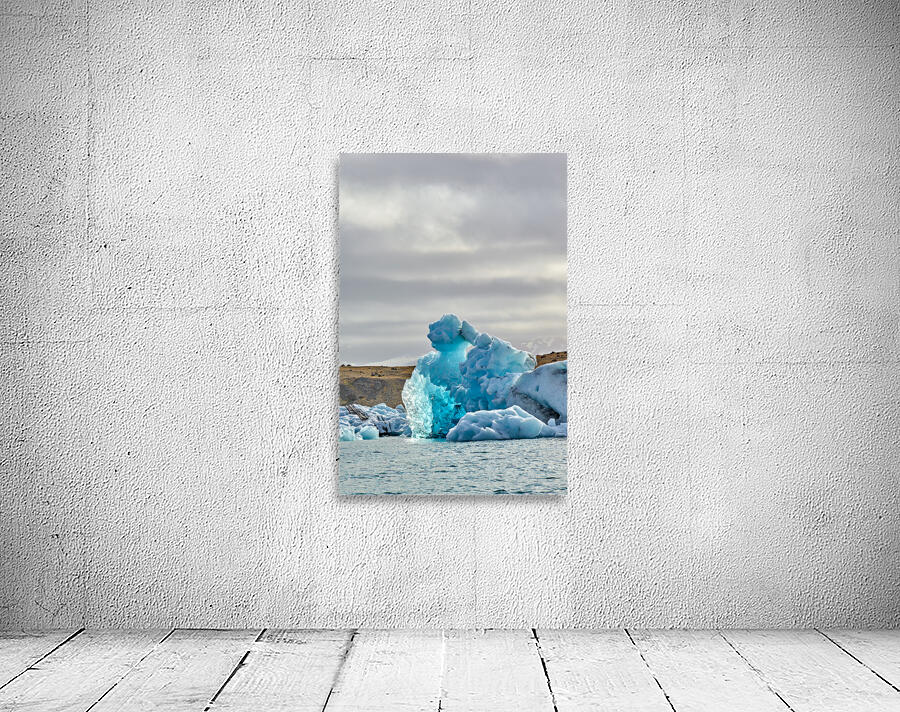Icebergs float in Jokulsarlon lagoon Iceland by day Wall Preview