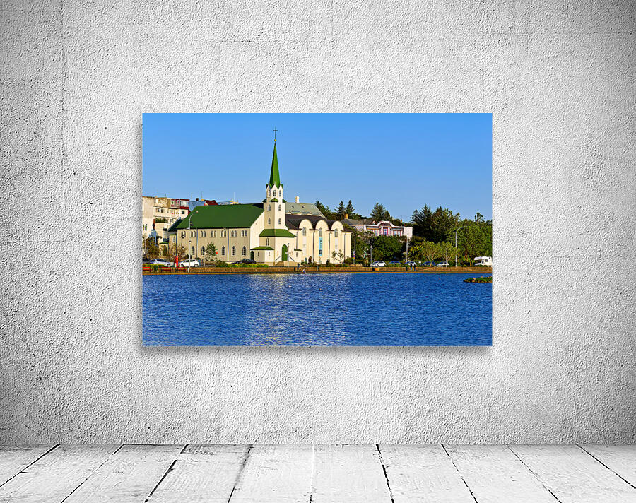 Lutheran Free Church near Lake Tjornin in Reykjavik Iceland Wall Preview