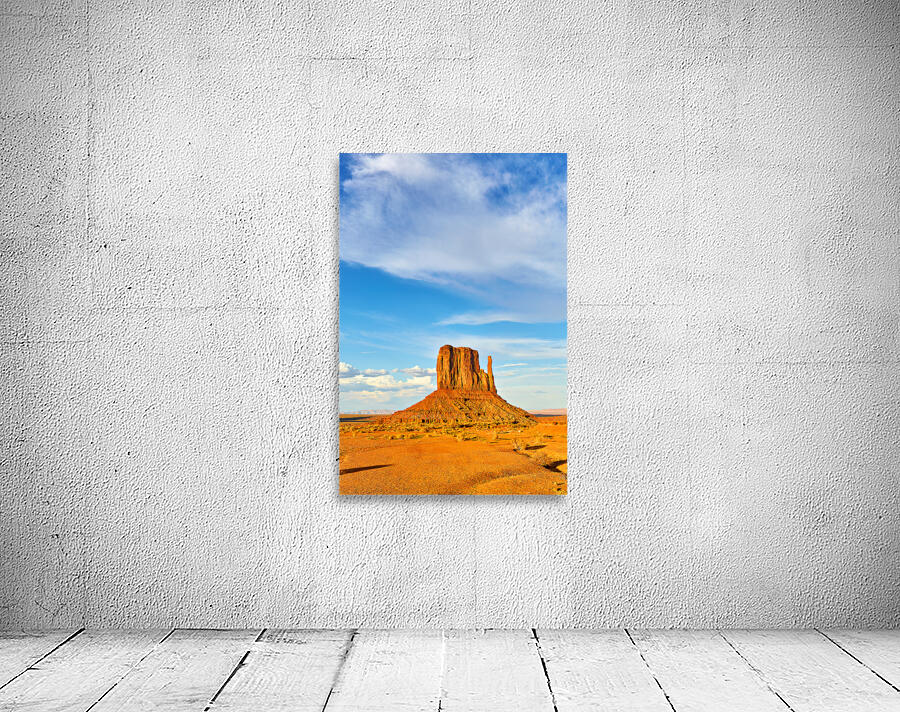 Monument Valley shows red rock formations under blue sky Wall Preview