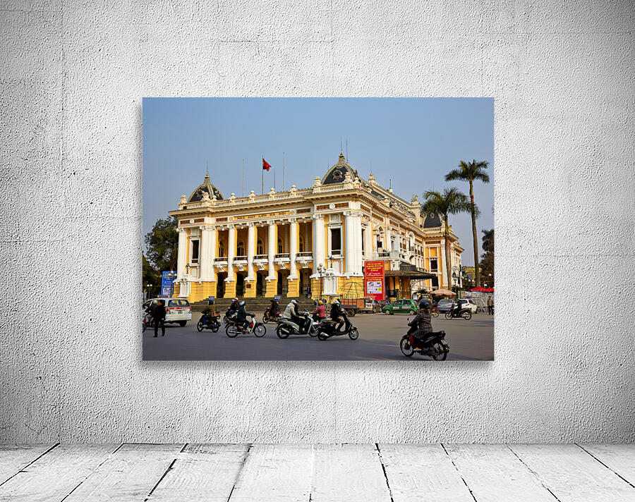 Building in Hanoi with people riding motorbikes in daytime Wall Preview