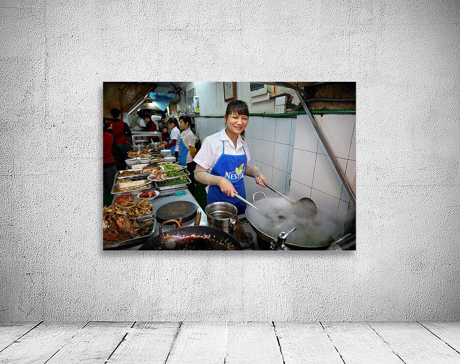 Chefs cook in busy kitchen in Hanoi during lunchtime rush Wall Preview