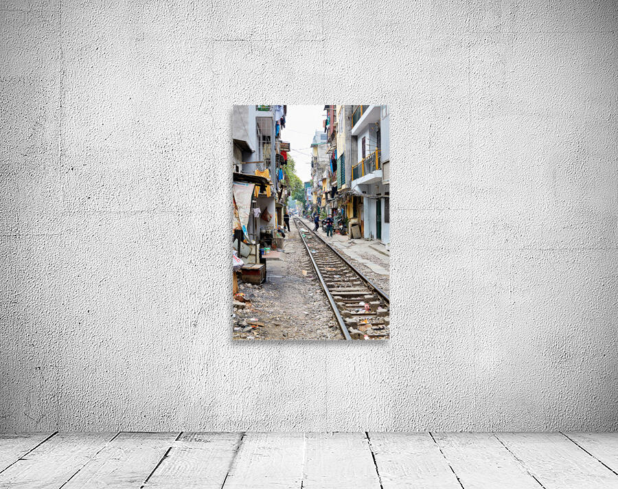 People walk along railway tracks in Ho Chi Minh City Vietnam Wall Preview
