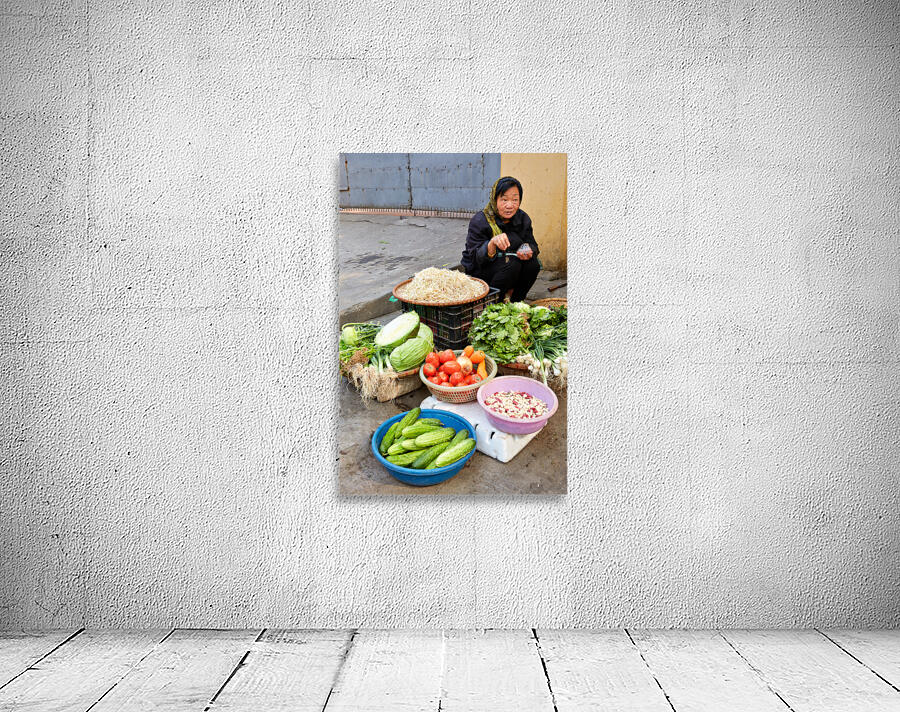 Woman sells fresh vegetables in Hanoi market Wall Preview