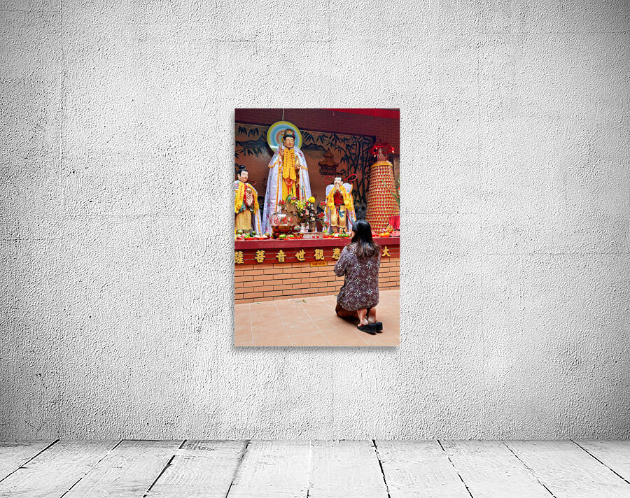 Prayer at Buddhist shrine in Ho Chi Minh City Vietnam Wall Preview