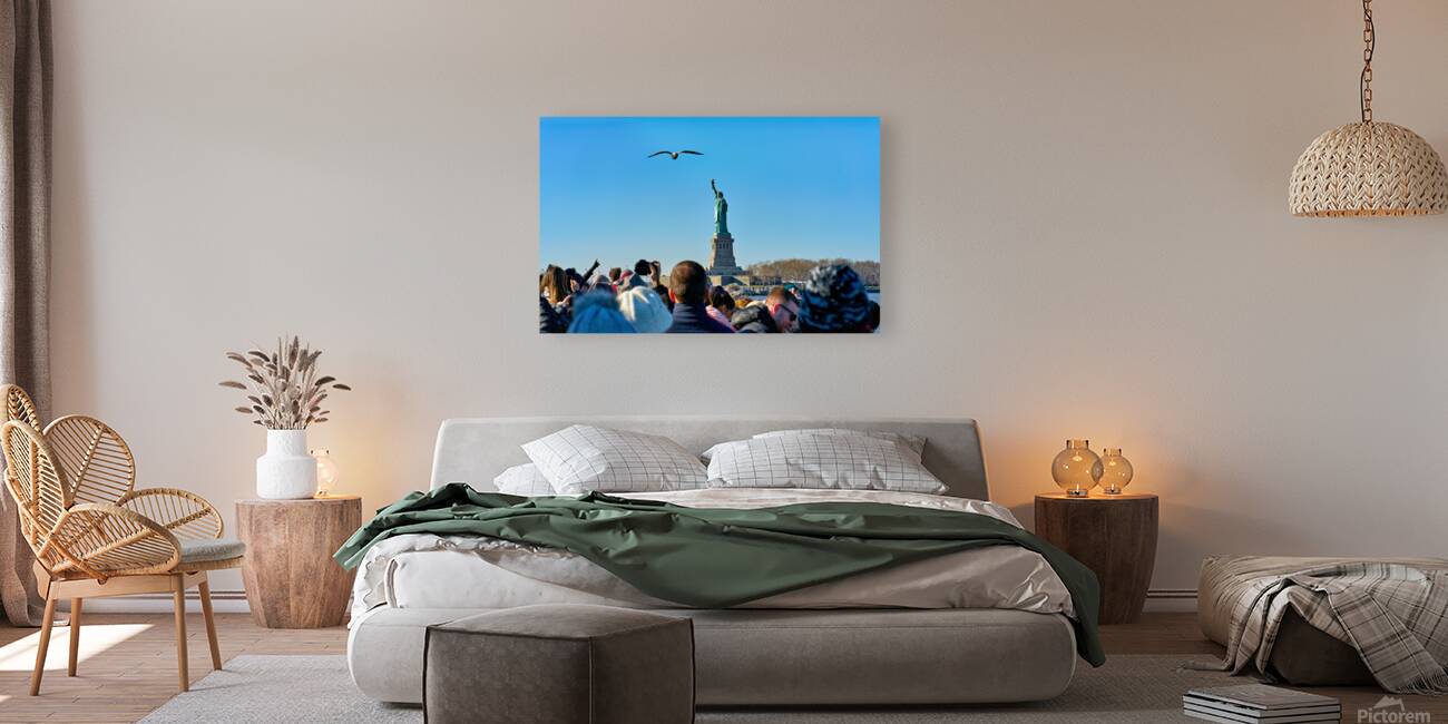 Tourists travel to Liberty Island by ferry in Manhattan New Yor Reproduction