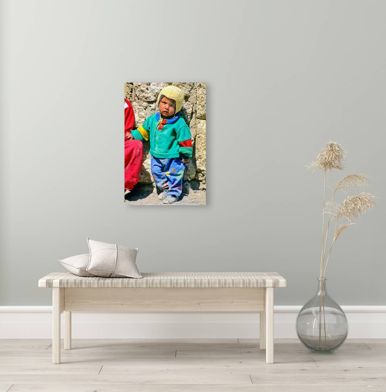 Indigenous child in colorful clothes and yellow hat outdoors. Reproduction